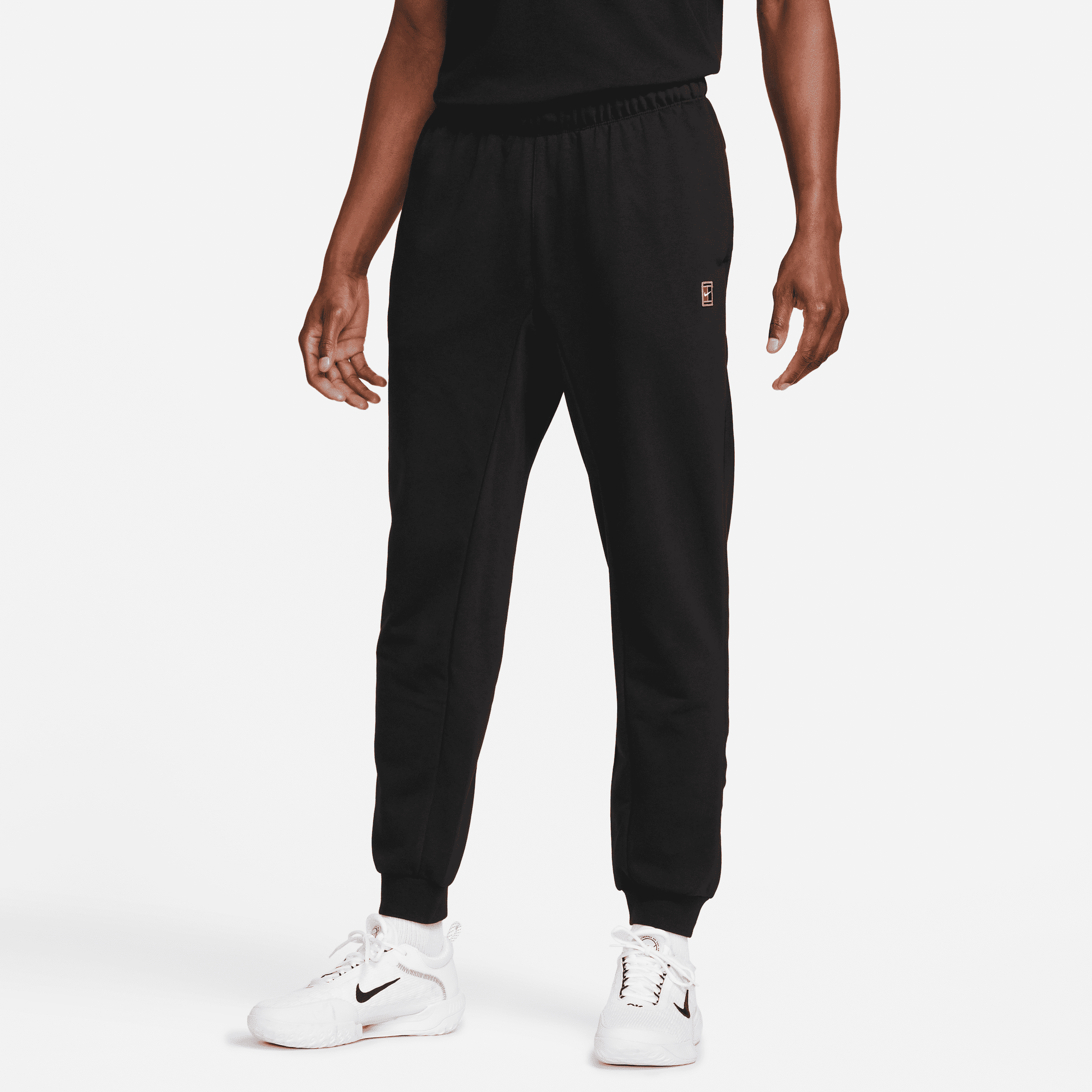 nike pantaloni da tennis in french terry court heritage – uomo - nero