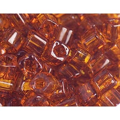 TOHO Perline giapponesi cubo trasparente bronzo 4mm. 100 g. TOHO Perline giapponesi cubo trasparente bronzo 4mm. 100 g.