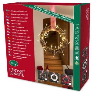 Konstsmide / Figura in legno LED corona bianca con nastro in tessile rosso/bianco / 30 diodi bianco caldo / 24V trasformatore da interno/cavo trasparente