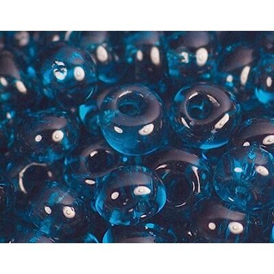 TOHO Perline giapponesi magatama trasparenti turchesi 3mm. 100 g. TOHO Perline giapponesi magatama trasparenti turchesi 3mm. 100 g.