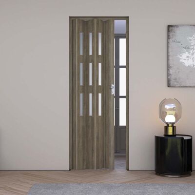 FORTE Porta A Soffietto Da Interno In Pvc 83x214 Cm Mod. Maya Colore Rovere Cognac Scuro Con Vetro Satinato FORTE Porta A Soffietto Da Interno In Pvc 83x214 Cm Mod. Maya Colore Rovere Cognac Scuro Con Vetro Satinato