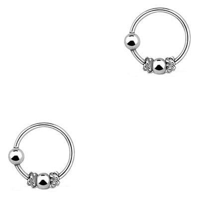DENI 2 kleine neusringen van sterling zilver, Bali design met sluiting, binnendiameter 7 mm, dikte 0,6 mm. DENI 2 kleine neusringen van sterling zilver, Bali design met sluiting, binnendiameter 7 mm, dikte 0,6 mm.