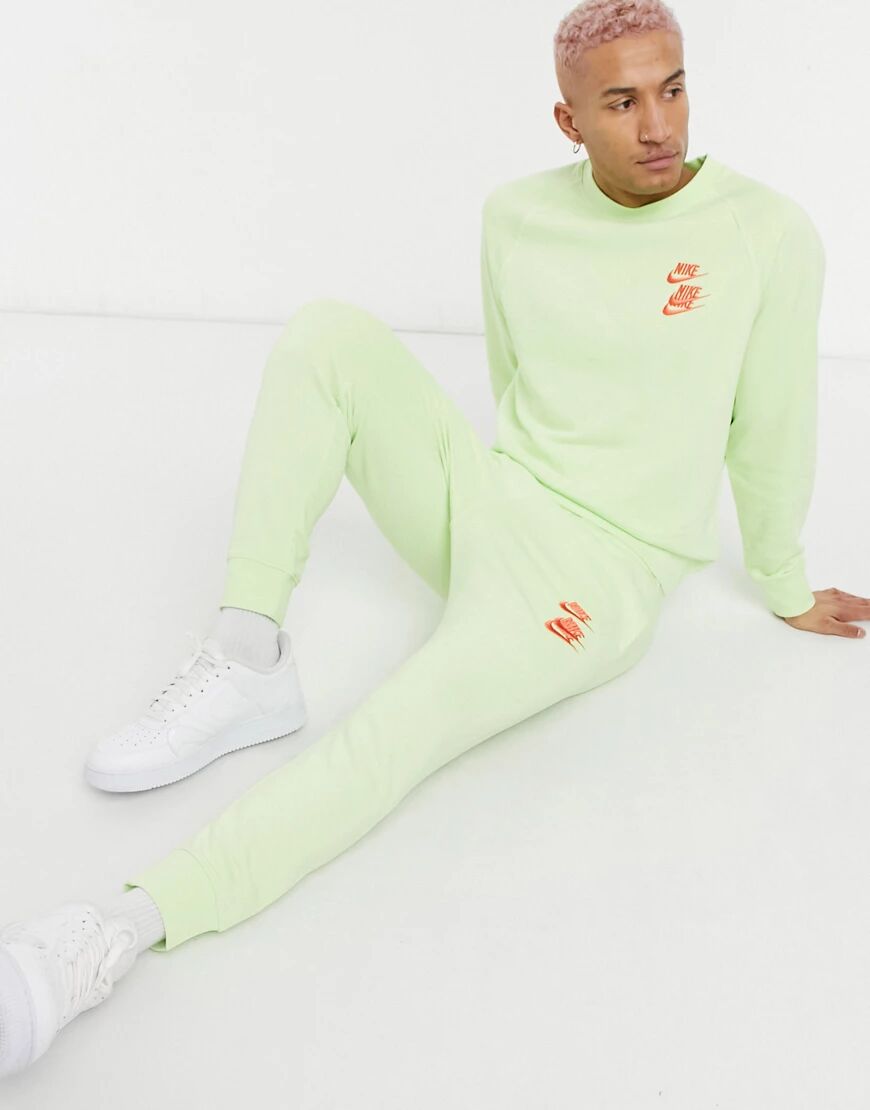 Nike World Tour Pack graphic cuffed joggers in lime-Green  Green