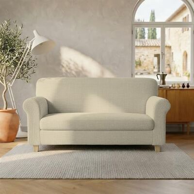 Italian Bed Linen LESLIE Elastyczna i rozciągliwa narzuta na sofę, 2-osobowa śmietana Italian Bed Linen LESLIE Elastyczna i rozciągliwa narzuta na sofę, 2-osobowa śmietana