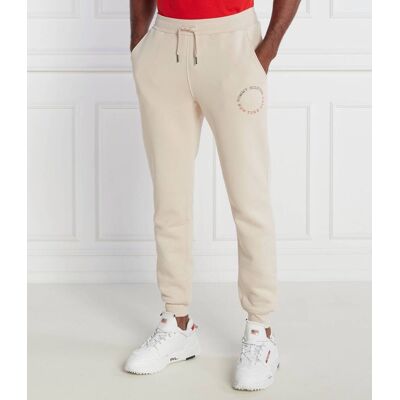 Tommy Hilfiger Spodnie dresowe MONOTYPE ROUNDALL Regular Fit beżowy XXL Tommy Hilfiger Spodnie dresowe MONOTYPE ROUNDALL Regular Fit beżowy XXL