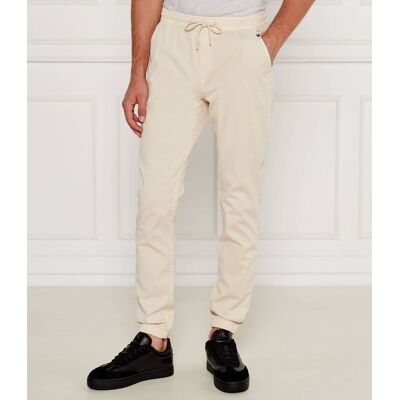 Tommy Jeans Spodnie jogger TJM AUSTIN Slim Fit kremowy XL Tommy Jeans Spodnie jogger TJM AUSTIN Slim Fit kremowy XL