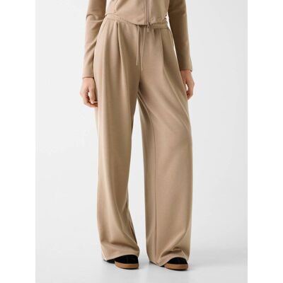 Guess ACTIVE Spodnie dresowe JASMINE Relaxed fit beżowy XS Guess ACTIVE Spodnie dresowe JASMINE Relaxed fit beżowy XS
