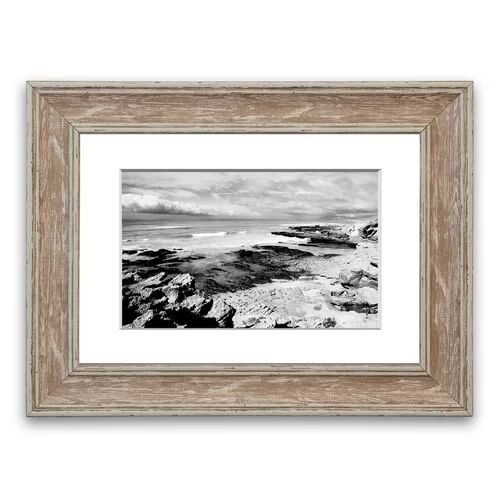East Urban Home 'Rocks of the Ocean Black and White Cornwall' Framed Photographic Print East Urban Home Size: 93 cm H x 126 cm W, Frame Options: Walnut  - Size: 93 cm H x 126 cm W