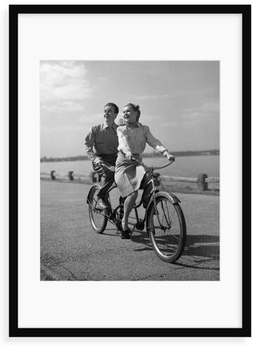 George Oliver '1950s Happy Couple Man Woman Riding Tandem Bike Bicycle Built for 2' Photograph George Oliver Format: Framed Paper, Size: 70 cm H x 50 cm W x 2.3 cm  - Size: 70 cm H x 50 cm W x 2.3 cm D George Oliver '1950s Happy Couple Man Woman Riding Tandem Bike Bicycle Built for 2' Photograph George Oliver Format: Framed Paper, Size: 70 cm H x 50 cm W x 2.3 cm  - Size: 70 cm H x 50 cm W x 2.3 cm D