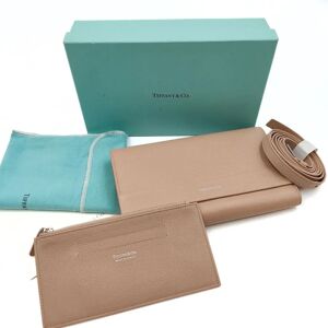 TIFFANY & CO. Tiffany & Co. Tiffany & Co. wallet with shoulder strap in beige leather - Size: W: 20cm - H: 13cmAll our items are selected, carefully sanitized and authenticated by our experts.CODE: 5374B197BRAND: Tiffany & Co.MADE IN: ItalyBeigeMATERI