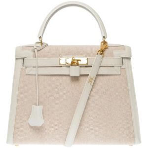Kelly 28 sellier handbag strap in White canvas and Beige leather, GHW - Size: 28x21x12 cm (11x8,3x4,7 Inches) Shoulder length: 90 cm (35.5 Inches) Reference: 101293 General condition: 7.5/10 Note that the bag was pampered in a specialized Hermes spa for c