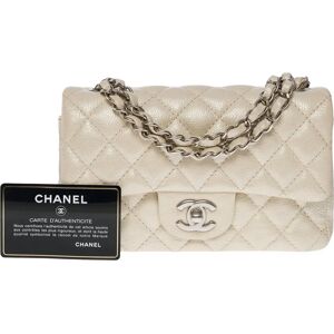 Chanel Splendid Timeless Mini Flap bag in off white pearl quilted leather, SHW - Size: 20 x 12 x 6 cm (7.9 x 4.7 x 2.4 Inches) Chain length: 60 cm (23.6 Inches) Reference: 100986 Packaging Hologram: Yes Authenticity card: Yes Dustbag: No Box: No General c