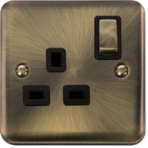 Se Home - Curved Antique Brass 1 Gang 13A dp Ingot Switched Plug Socket - Black Trim Se Home - Curved Antique Brass 1 Gang 13A dp Ingot Switched Plug Socket - Black Trim