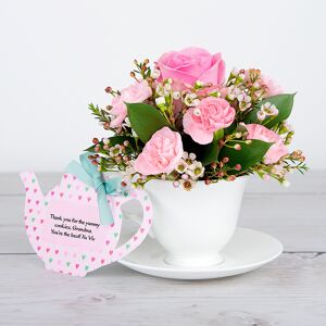 www.flowercard.co.uk Pink Roses, Spray Carnations, White Waxflower and Dried Poppy Heads inside Bone China Teacup and Saucer