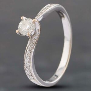 Pre-Owned 18ct White Gold 0.33ct Brilliant Cut Diamond Twist Shoulder Set Solitaire Ring 41481642 Pre-Owned 18ct White Gold 0.33ct Brilliant Cut Diamond Twist Shoulder Set Solitaire Ring 41481642