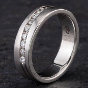 Pre-Owned 14ct White Gold 0.25ct Brilliant Cut Diamond Channel Set Textured 5.0mm Wedding Ring 4312112 Pre-Owned 14ct White Gold 0.25ct Brilliant Cut Diamond Channel Set Textured 5.0mm Wedding Ring 4312112