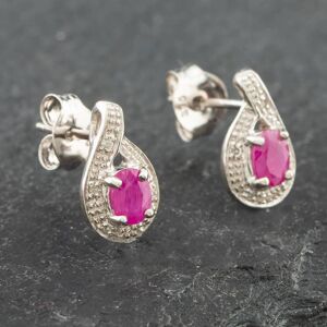 Pre-Owned White Gold 0.38ct Oval Cut Ruby & 0.03ct Diamond Swirl Stud Earrings 43171089 Pre-Owned White Gold 0.38ct Oval Cut Ruby & 0.03ct Diamond Swirl Stud Earrings 43171089