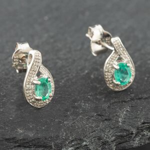 Pre-Owned White Gold 0.30ct Oval Cut Emerald & 0.03ct Diamond Swirl Stud Earrings 43171090 Pre-Owned White Gold 0.30ct Oval Cut Emerald & 0.03ct Diamond Swirl Stud Earrings 43171090