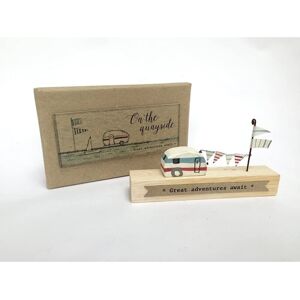 East of India on the quayside great adventures await wooden caravan East of India on the quayside great adventures await wooden caravan