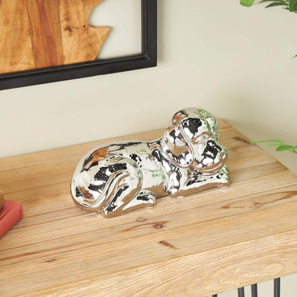 Litton Lane Silver Ceramic Laying Dog Sculpture with Matte Finish