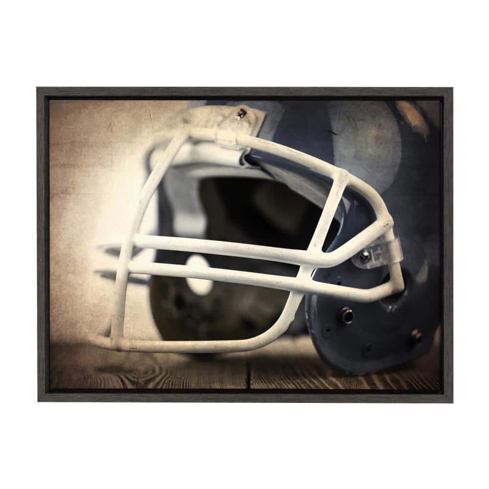 DesignOvation Sylvie "Vintage Football Helmet" by Saint and Sailor Studios 24 in. x 18 in. Framed Canvas Wall Art