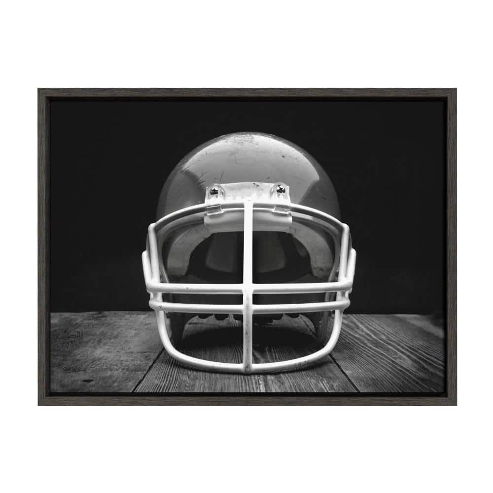 DesignOvation Sylvie "Vintage Football Helmet on Black" by Saint and Sailor Studios Sports Framed Canvas Wall Art 24 in. x 18 in.