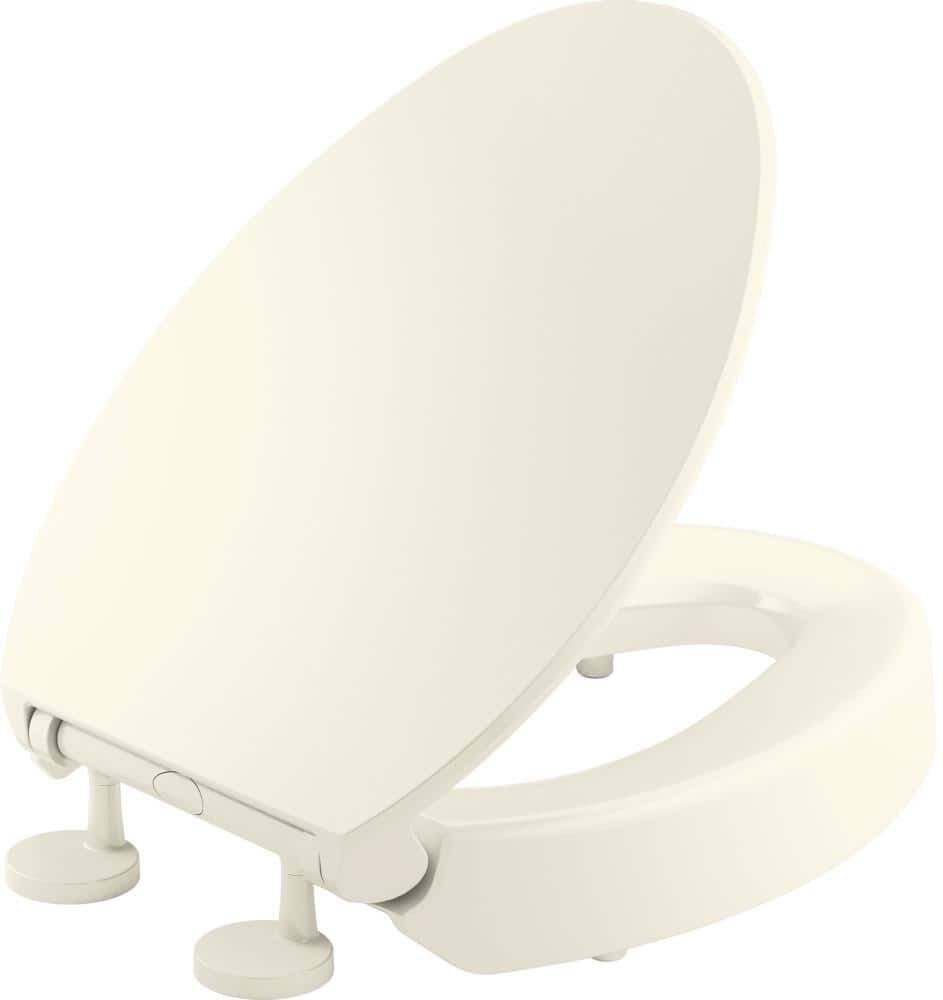 KOHLER Hyten Elevated Quiet-Close Elongated Toilet Seat in Biscuit