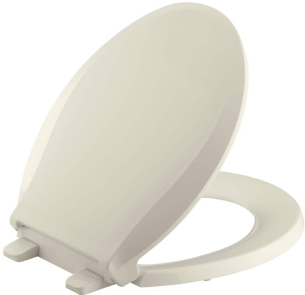 KOHLER Cachet Quiet-Close Round Closed Front Toilet Seat with Grip-Tight Bumpers in Almond