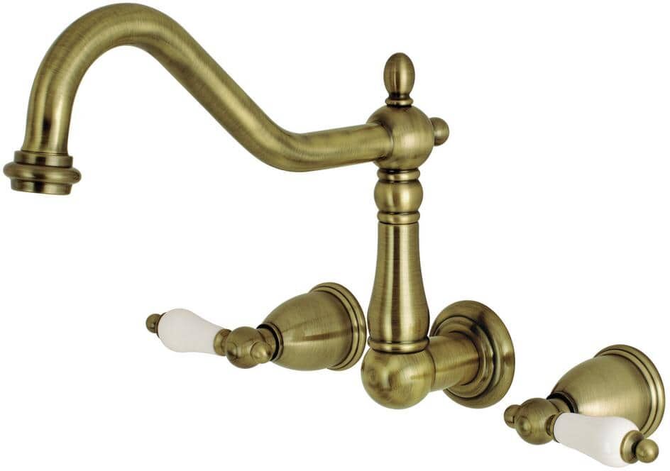 Kingston Heritage 2-Handle Wall Mount Roman Tub Faucet in Antique Brass