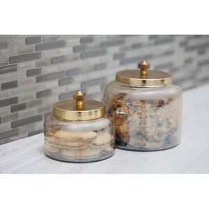 CosmoLiving by Cosmopolitan Gold Glass Living Room Decorative Jars with Metal Lids (Set of 2) Gold 5.0 In. L X 5.0 In. W X 5.0 In. H CosmoLiving by Cosmopolitan Gold Glass Living Room Decorative Jars with Metal Lids (Set of 2) Gold 5.0 In. L X 5.0 In. W X 5.0 In. H