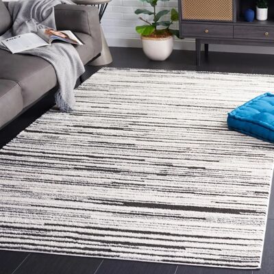 Tapis polyester ivoire/noir Safavieh - 185x275cm - Style bohème moderne - Publicité Tapis polyester ivoire/noir Safavieh - 185x275cm - Style bohème moderne - Publicité