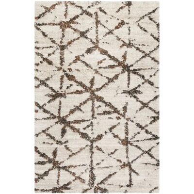 Tapis à poils longs beige et marron - Esprit - Publicité Tapis à poils longs beige et marron - Esprit - Publicité
