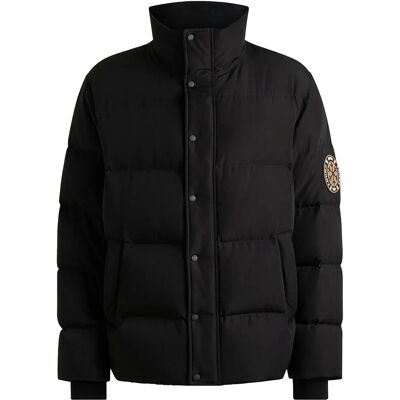 BOSS - Ski - Imperméable - Veste en duvet - Publicité BOSS - Ski - Imperméable - Veste en duvet - Publicité