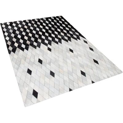 Tapis en cuir noir et blanc 140x200cm Patchwork moderne - Publicité Tapis en cuir noir et blanc 140x200cm Patchwork moderne - Publicité