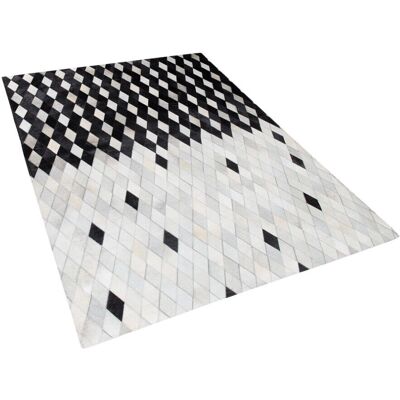 Tapis en cuir noir et blanc Beliani 160x230cm Style patchwork moderne - Publicité Tapis en cuir noir et blanc Beliani 160x230cm Style patchwork moderne - Publicité